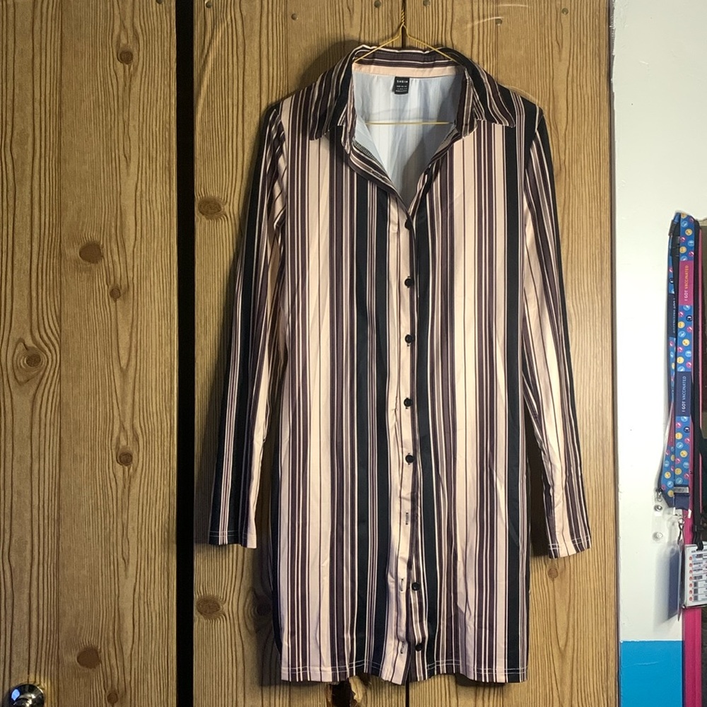 Brand new stripped brown, cream, and black satin above the knee dress